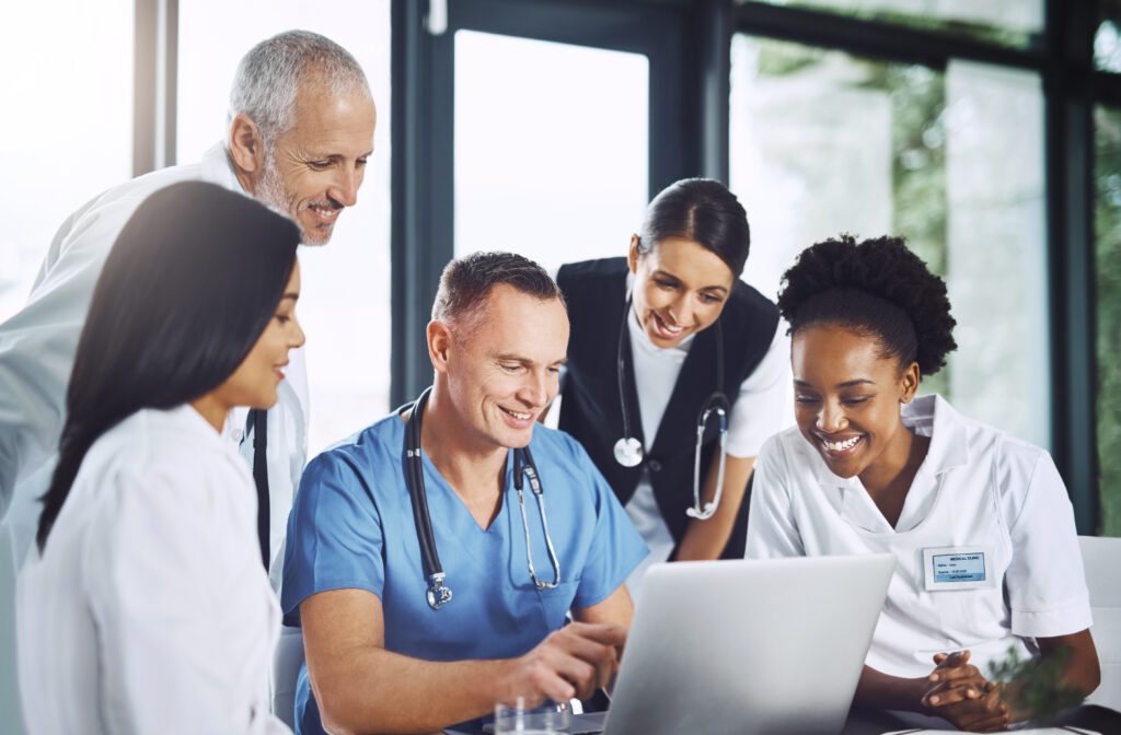 Doctors collaborating on a medical report at an EndoSoft office.