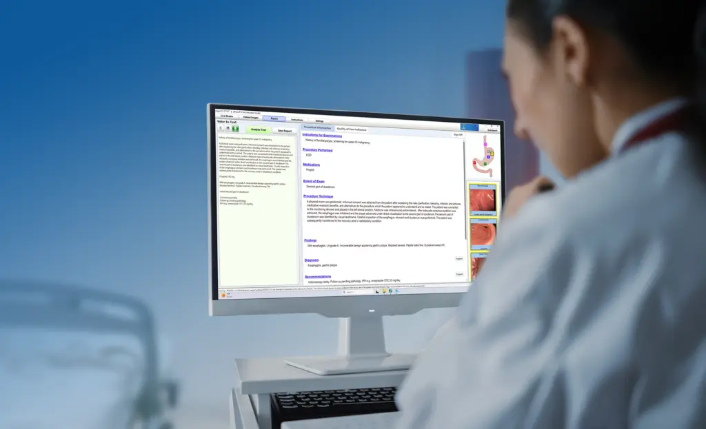 Woman dictating to a computer with EndoSpeech medical dictation software