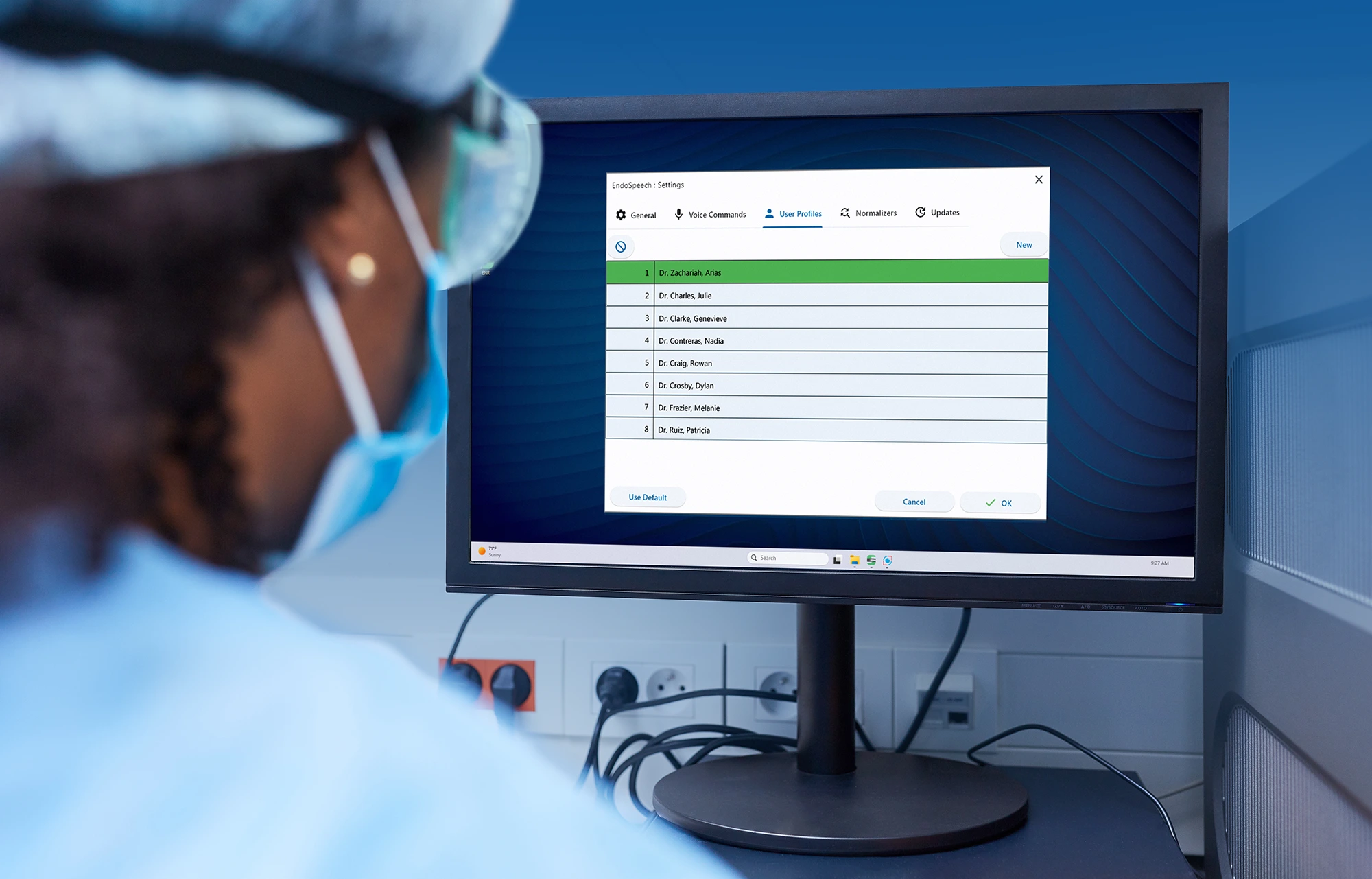 Nurse looking at a computer screen showing voice profiles for EndoSpeech medical dictation software