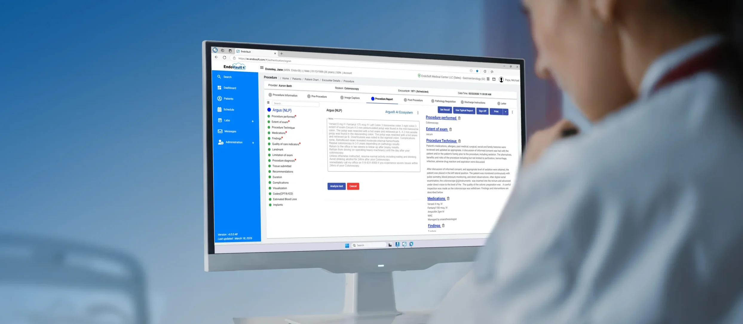 Woman standing at a computer showing EndoVault 4, cloud based procedure documentation software