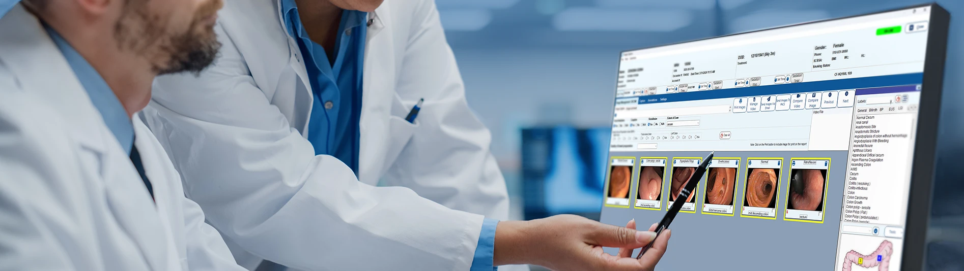 Two medical professionals analyzing the image capture & management screen within endovault.